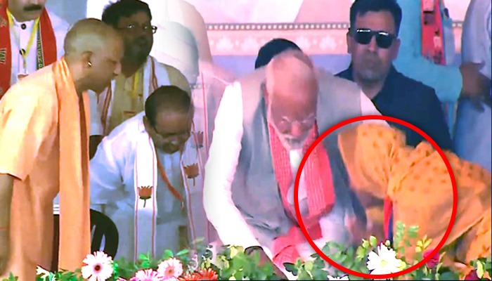 Mirzapur की रैली में अचानक PM Modi के पैरों में पड़ी महिला, हैरान रह गए योगी
